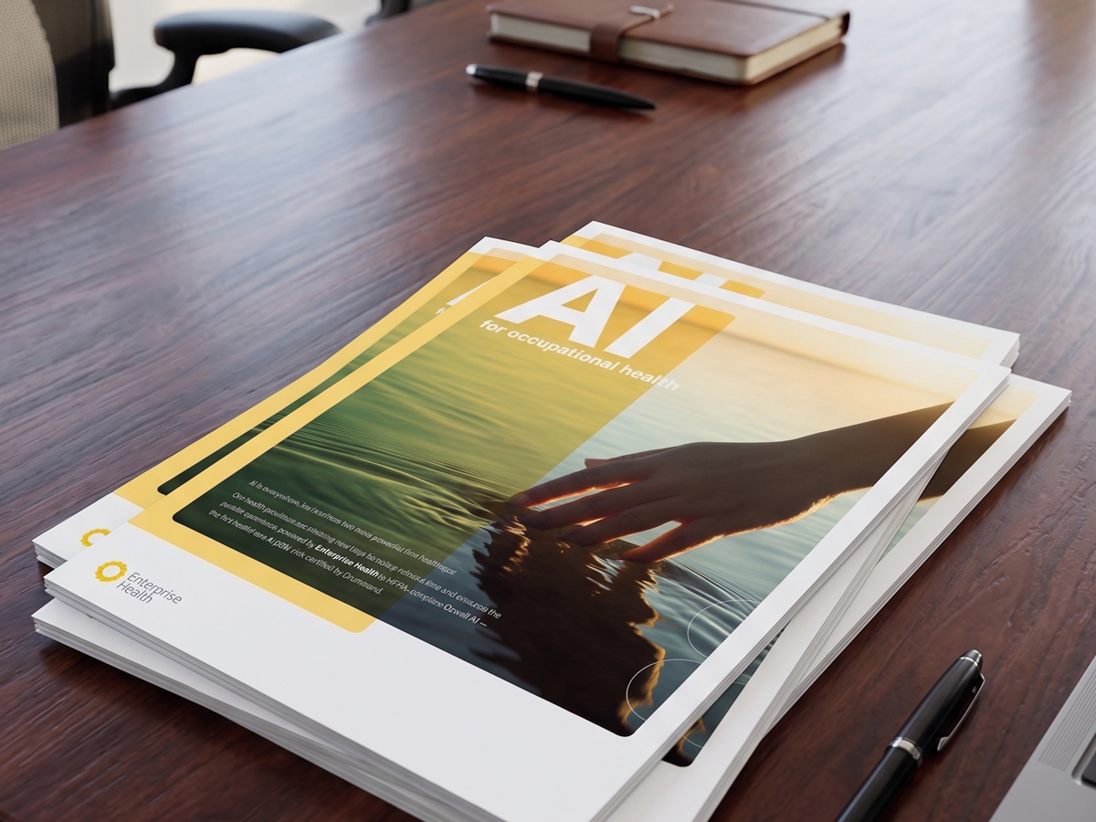A stack of Enterprise Health AI for occupational health brochures on a conference table
